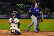 Texas Rangers' Wyatt Langford, right, scores after hitting a two-run home run as Los Angeles...