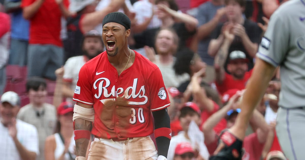 Benson triples and scores on 9th-inning error to left the Reds past the Rockies, 4-3