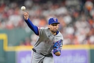 Texas Rangers starting pitcher Nathan Eovaldi throws against the Houston Astros during the...