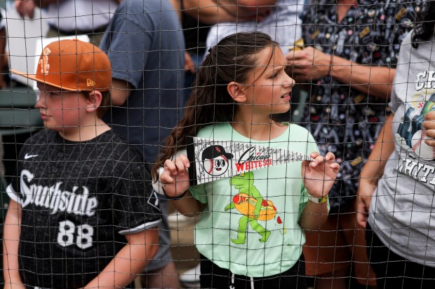 A Chicago White Sox holds a singed pennant before the game against the Cleveland Guardians at Rate Field on Sunday, July 13, 2025. (Eileen T. Meslar/Chicago Tribune)