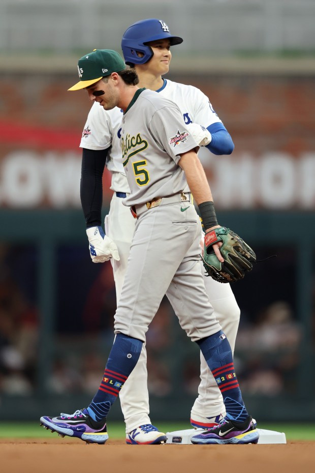 Shohei Ohtani #17 of the Los Angeles Dodgers stands on second base behind Jacob Wilson #5 of the Athletics during the first inning of the MLB All-Star Game at Truist Park on July 15, 2025 in Atlanta, Georgia. (Photo by Kevin C. Cox/Getty Images)