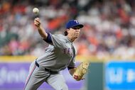 Texas Rangers starting pitcher Jacob deGrom throws against the Houston Astros during the...