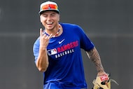 Texas Rangers infielder Cody Freeman hams it up during a spring training workout at the...