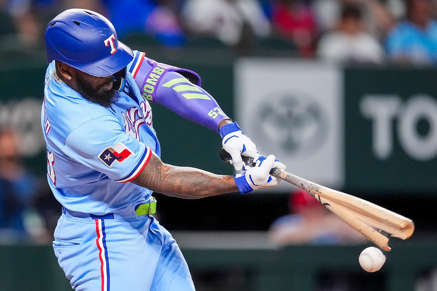 Texas Rangers outfielder Adolis García breaks his bat on a pitch from Detroit Tigers pitcher...