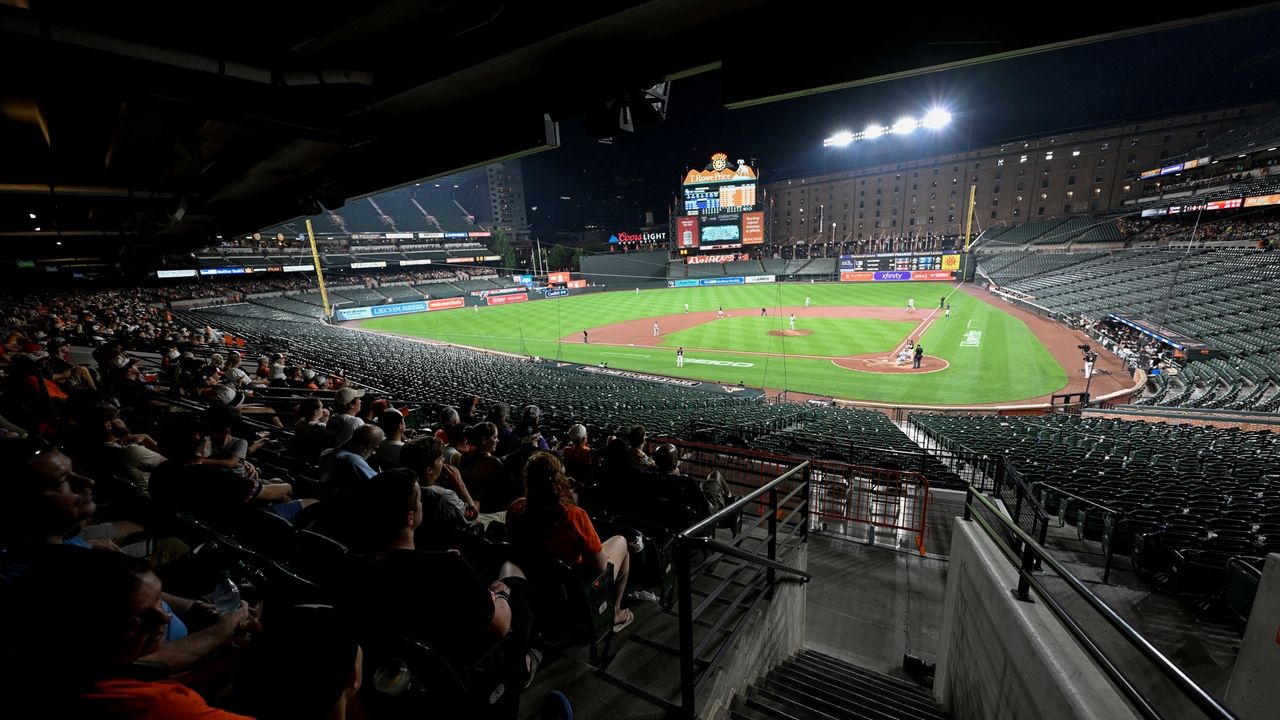 Why did the Orioles and Rockies keep playing after fans evacuated seats?