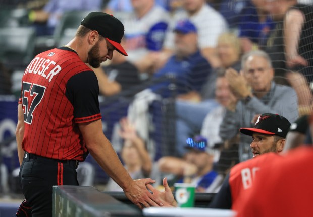 White Sox starter Adrian Houser enters the dugout after being taken out of the game in the seventh inning against the Cubs on July 25, 2025, at Rate Field. (John J. Kim/Chicago Tribune)