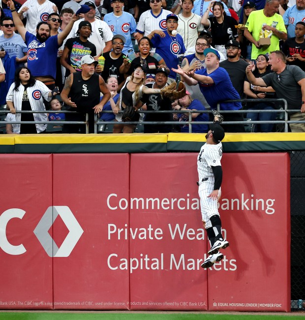 White Sox right fielder Mike Tauchman is unable to catch a ball that went for a solo home run for Cubs left fielder Ian Happ in the seventh inning on July 26, 2025, at Rate Field. (Chris Sweda/Chicago Tribune)
