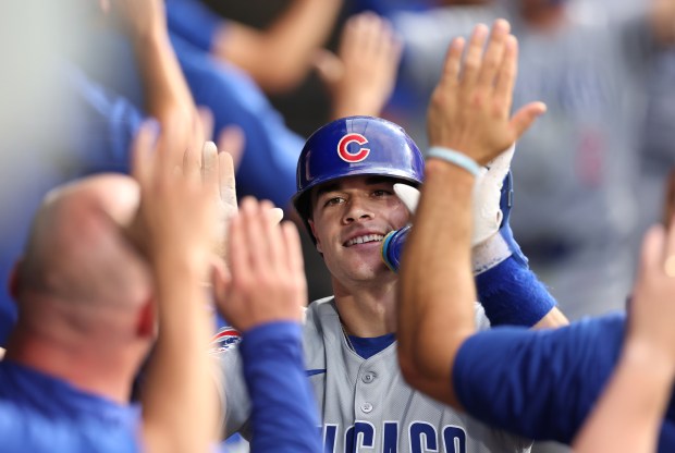 Cubs third baseman Matt Shaw high-fives teammates in the dugout after hitting a two-run home run in the seventh inning against the White Sox on July 26, 2025, at Rate Field. (Chris Sweda/Chicago Tribune)