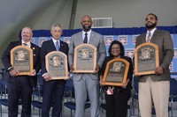 Baseball Hall of Fame inductees Billy Wagner, left, Ichiro Suzuki, second from left, and CC Sabathia, center, pose for a photo with Willa Allen, second from right, widow of Baseball Hall of Fame inductee Dick Allen, and Dave Parker II, right, son of the late Baseball Hall of Fame inductee Dave Parker, at the National Baseball Hall of Fame induction ceremony in Cooperstown, N.Y., July 27, 2025. (AP Photo/Seth Wenig)