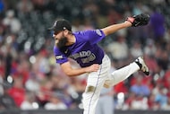 Colorado Rockies relief pitcher Jake Bird works against the St. Louis Cardinals in the ninth...