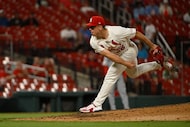 St. Louis Cardinals relief pitcher Ryan Helsley throws against the Washington Nationals...