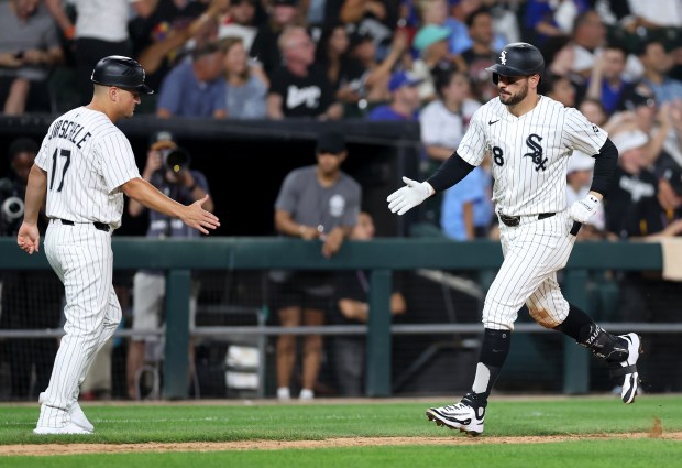 White Sox right fielder Mike Tauchman, right, rounds the bases after hitting a solo home run in the ninth inning against the Cubs on July 26, 2025, at Rate Field. (Chris Sweda/Chicago Tribune)