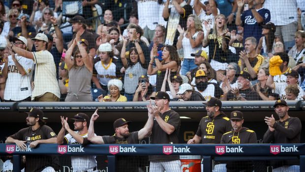 San Diego Padres dugout celebrates after Jackson Merrill #3 double against the New York Mets during the first inning at Petco Park on Tuesday, July 29, 2025 in San Diego, CA. (Meg McLaughlin / The San Diego Union-Tribune)