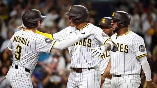 Manny Machado #13 of the San Diego Padres celebrates with Jackson Merrill #3 after Machado's home run against the New York Mets during the seventh inning at Petco Park on Tuesday, July 29, 2025 in San Diego, CA. (Meg McLaughlin / The San Diego Union-Tribune)