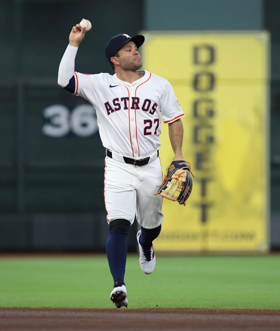 Mar 27, 2025; Houston, Texas, USA;Houston Astros left fielder Jose Altuve (27) reacts after making a catch against New York Mets left fielder Brandon Nimmo (9) (not pictured) in the first inning at Daikin Park. Mandatory Credit: Thomas Shea-Imagn Images