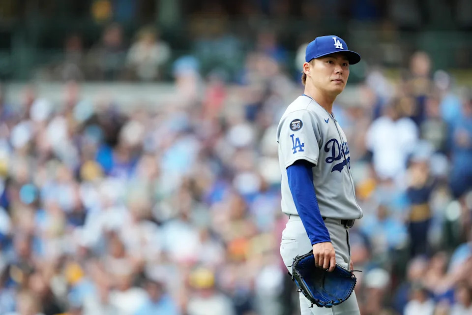 Yoshinobu Yamamoto reacts to being pulled from the shortest outing of his MLB career. (Patrick McDermott/Getty Images)