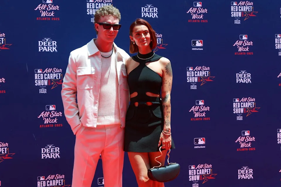 National League outfielder Pete Crow-Armstrong (4) of the Chicago Cubs and girlfriend Hailey Lavelle pose for photo on the red carpet before the 2025 MLB All Star Game at Truist Park. IMAGN IMAGES via Reuters Connect