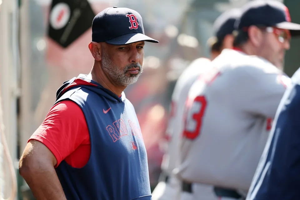 Boston Red Sox manager Alex Cora (13) looks down in the dugout during the eighth inning against the Los Angeles Angels at Angel Stadium. Kiyoshi Mio-Imagn Images