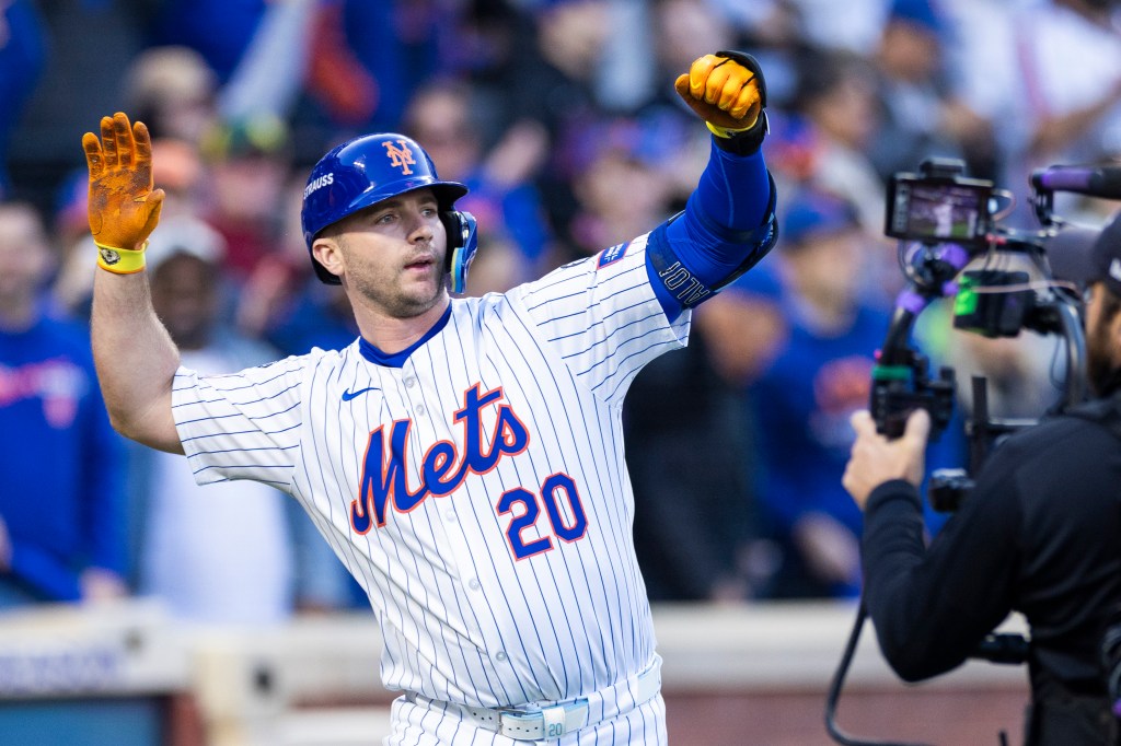 Pete Alonso #20 of the New York Mets celebrates after he scores on his three-run home run during the first inning of game five of the NLCS at Citi Field, Friday, Oct. 18, 2024, in Queens, New York.