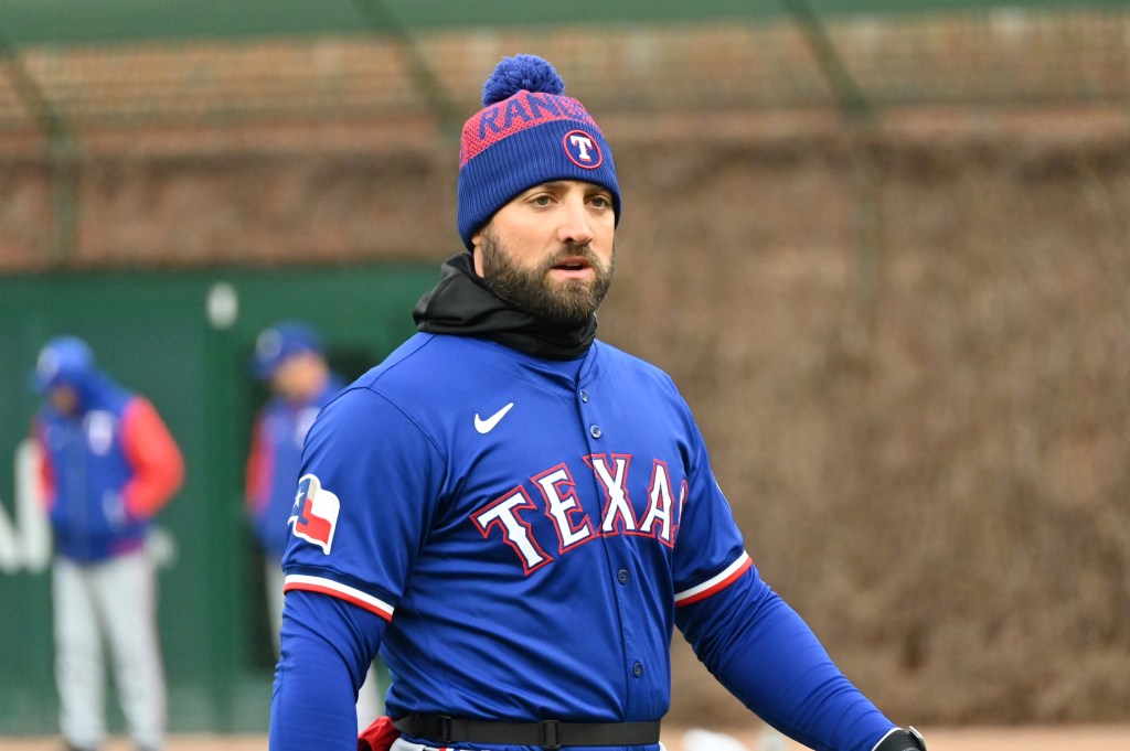 Texas Rangers left fielder Kevin Pillar (1) is seen warming up prior to a game against the Chicago Cubs at Wrigley Field.