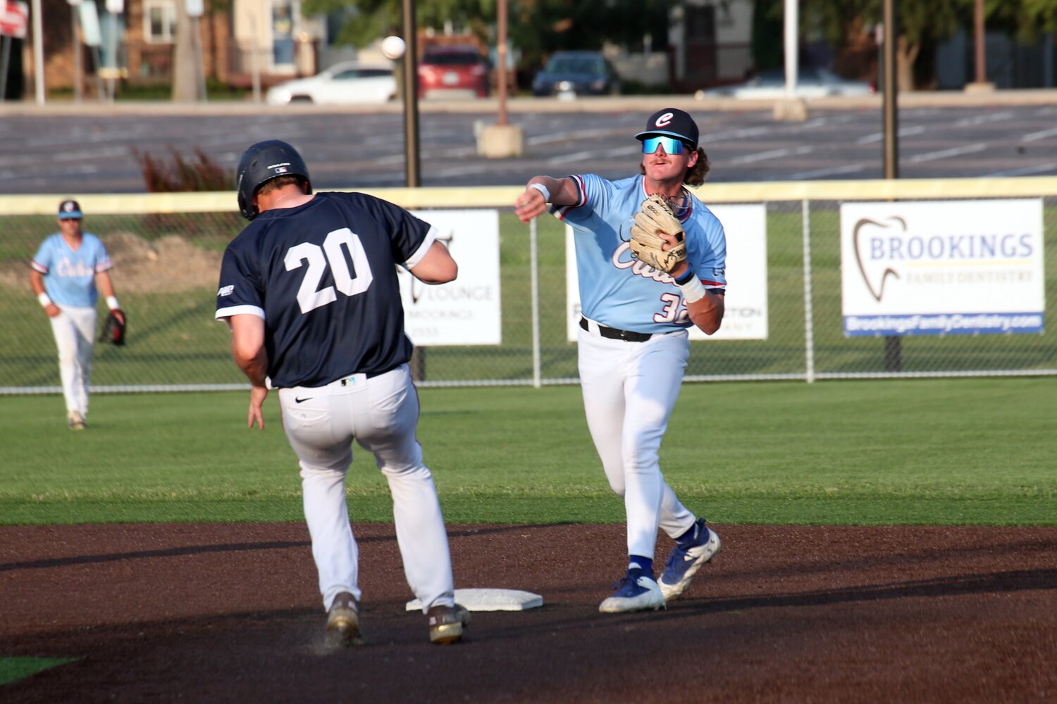 Brookings second baseman Colin Gibson turns a double play during a 9-5 loss to Harrisburg on Tuesday night at Bob Shelden Field in Brookings.