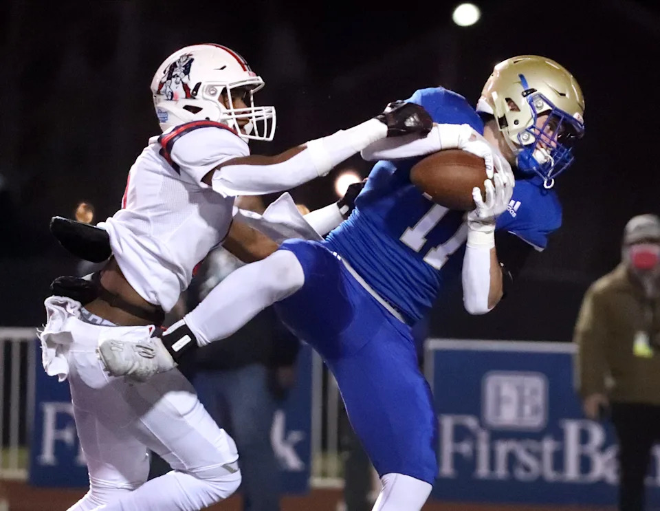 Brentwood's Aaron Walton (11) catches the ball to score a touchdown as Oakland's Dylan King (6) tackles him during the first quarter of the Class 6A BlueCross Bowl Football Championship game at Tucker Stadium in Cookeville, Tenn., Saturday, Dec. 5, 2020.