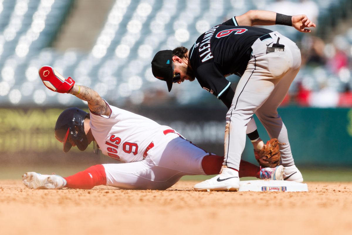 Zach Neto #9 of the Los Angeles Angels slides safe into second base against Blaze Alexander #9 of the Arizona Diamondbacks during the game at Angel Stadium of Anaheim on July 13, 2025 in Anaheim, California.