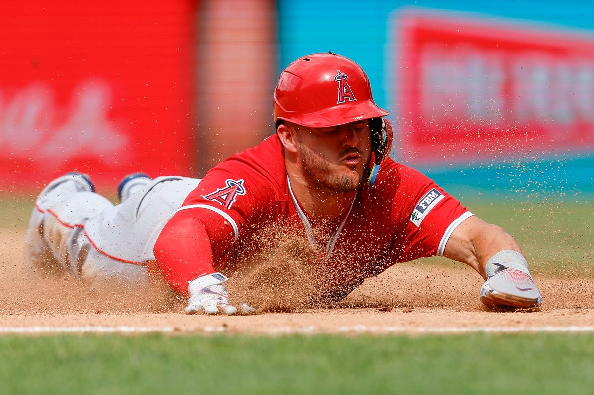 Mike Trout #27 of the Los Angeles Angels slides into third base during a game against the Philadelphia Phillies at Citizens Bank Park on July 19, 2025, in Philadelphia, Pennsylvania. Mike Trout #27 of the Los Angeles Angels slides into third base during a game against the Philadelphia Phillies at Citizens Bank Park on July 19, 2025, in Philadelphia, Pennsylvania.