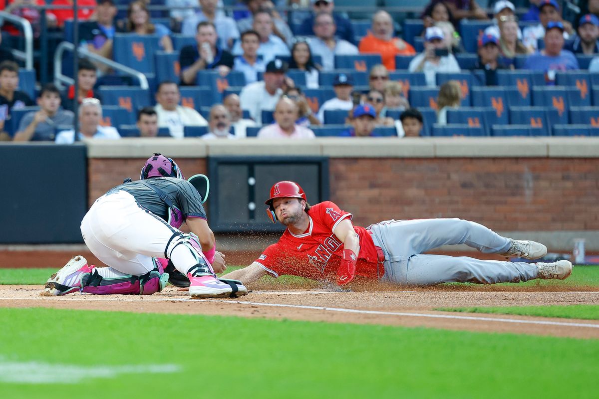 Nolan Schanuel #18 of the Los Angeles Angels is tagged out at home plate against the New York Mets at Citi Field on July 22, 2025 in Flushing, NY. Nolan Schanuel #18 of the Los Angeles Angels is tagged out at home plate against the New York Mets at Citi Field on July 22, 2025 in Flushing, NY.