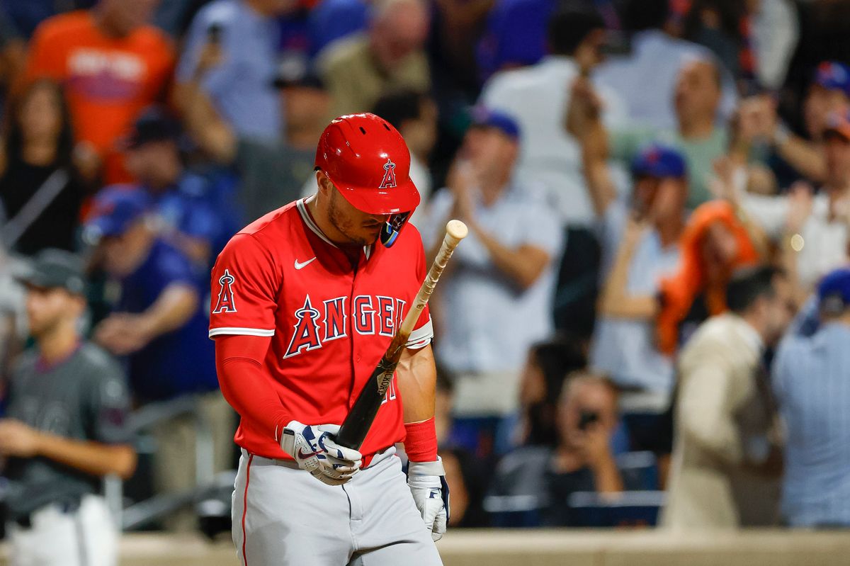 Mike Trout #27 of the Los Angeles Angels heads to the dugout after striking out against the New York Mets at Citi Field on July 22, 2025 in Flushing, NY. Mike Trout #27 of the Los Angeles Angels heads to the dugout after striking out against the New York Mets at Citi Field on July 22, 2025 in Flushing, NY.