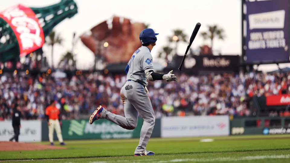 Dodgers star Shohei Ohtani tosses his bat after hitting a two-run home run in the third inning against the Giants on Friday.