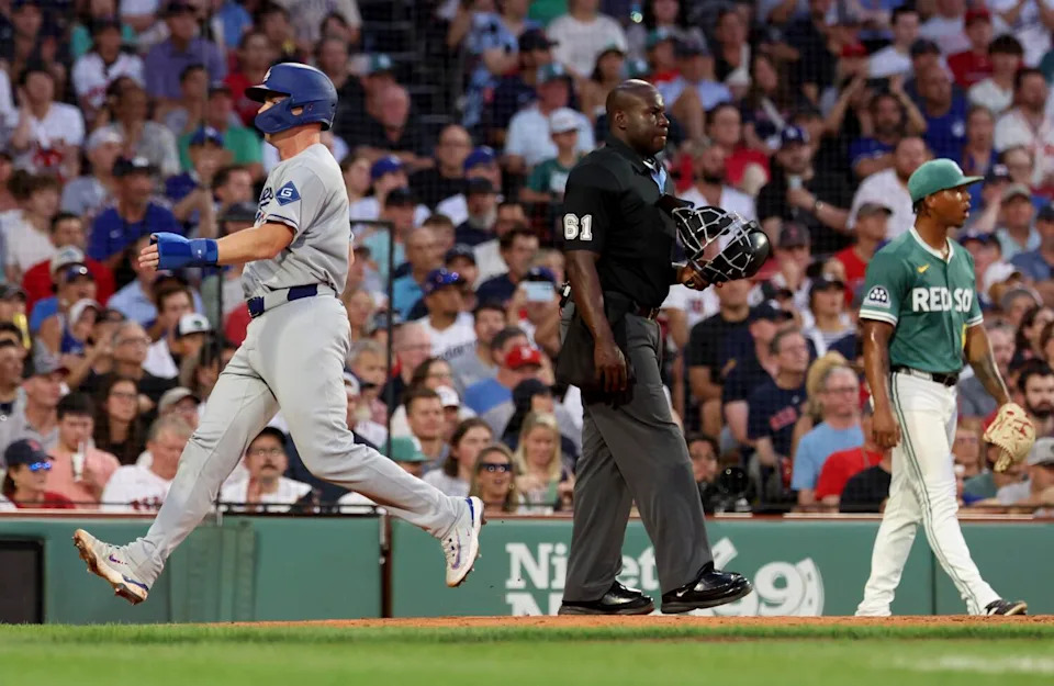 Dodgers' Will Smith scores on a sacrifice fly by teammate Andy Pages during the third inning against the Red Sox on Friday.