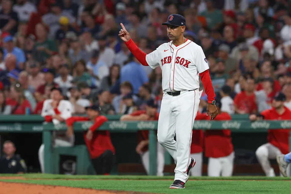 Boston Red Sox manager Alex Cora (13) makes a pitching change during the seventh inning against the Toronto Blue Jays at Fenway Park. Paul Rutherford-Imagn Images
