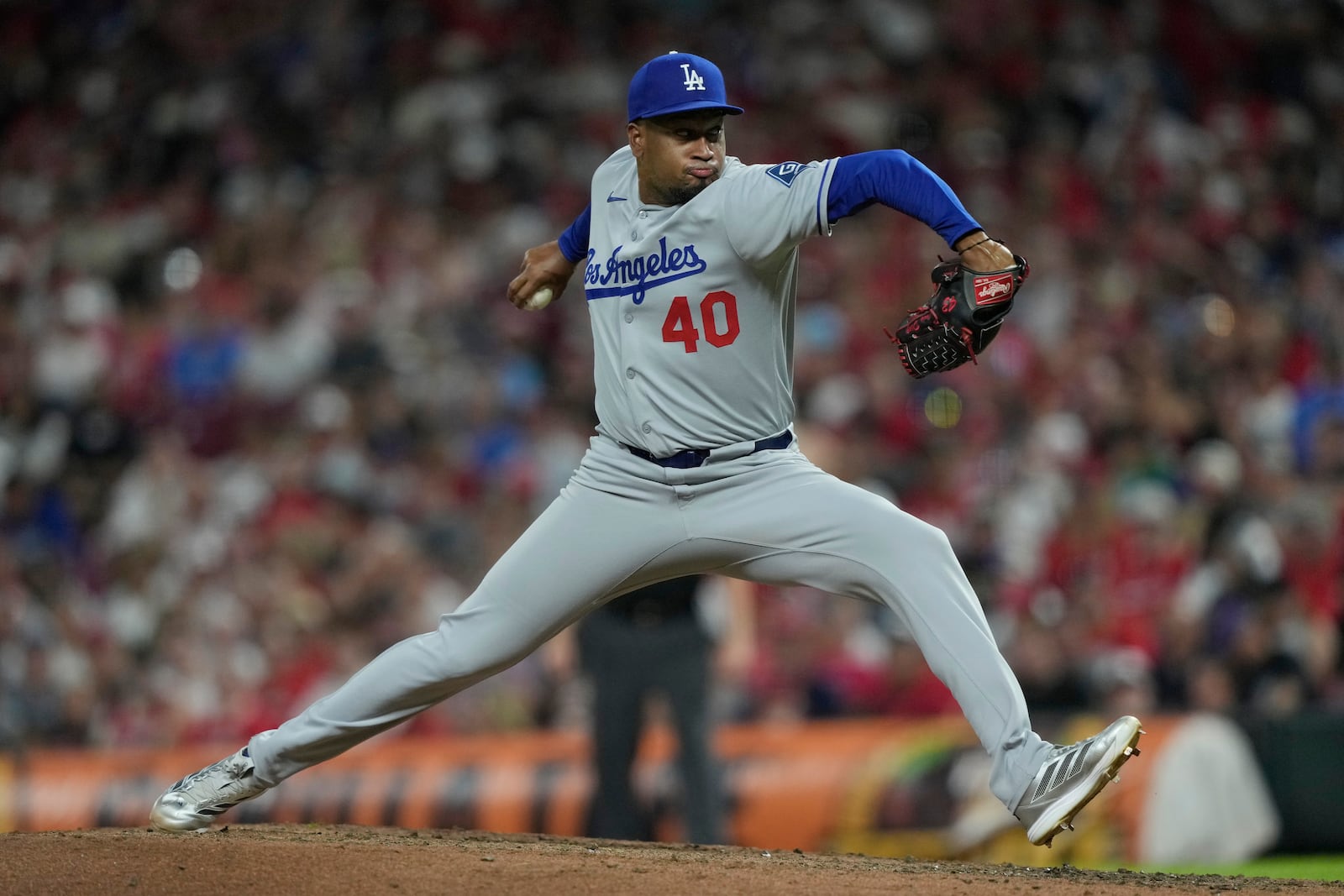 Los Angeles Dodgers pitcher Alexis Díaz throws during the eighth inning of a baseball game against the Cincinnati Reds, Tuesday, July 29, 2025, in Cincinnati. (AP Photo/Carolyn Kaster)
