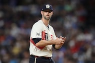 Texas Rangers pitcher Chris Martin looks on from the field during the eighth inning of a...