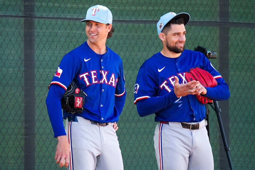 Texas Rangers pitcher Jacob deGrom (left) talks with pitcher Nathan Eovaldi before throwing...