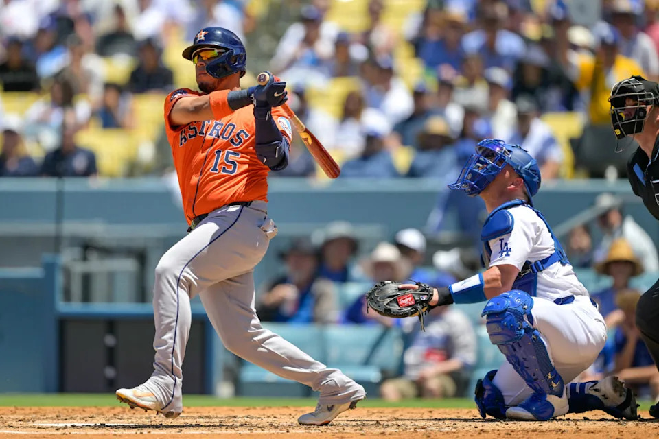 Houston Astros designated hitter Isaac Paredes (15) hits a double against the Los Angeles Dodgers during the third inning of the game at Dodger Stadium.Jayne Kamin-Oncea-Imagn Images