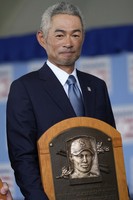 Baseball Hall of Fame inductee Ichiro Suzuki poses for a photo with his plaque after the National Baseball Hall of Fame induction ceremony in Cooperstown, N.Y., July 27, 2025. (AP Photo/Seth Wenig)