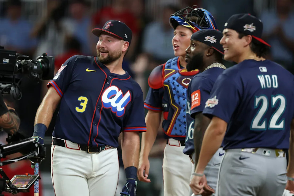 ATLANTA, GEORGIA - JULY 14: Cal Raleigh #29 of the Seattle Mariners celebrates with teammates Bryan Woo #22 and Randy Arozarena #56 and brother Todd Raleigh Jr. after the final round of the Home Run Derby at Truist Park on July 14, 2025 in Atlanta, Georgia.  (Photo by Kevin C. Cox/Getty Images)