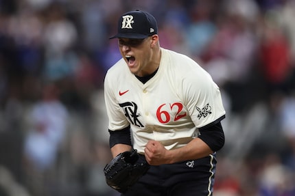 Texas Rangers pitcher Robert Garcia celebrates after striking out Detroit Tigers' Jake...