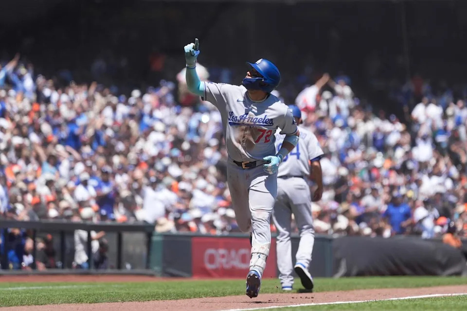 Miguel Rojas gestures after hitting a home run in the fifth inning for the Dodgers on Sunday.