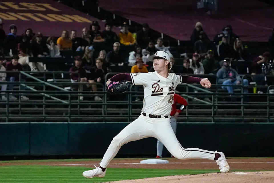 Starting pitcher, Ben Jacobs (22) of the Arizona State Sun Devils throws at the home opener against Ohio State at Phoenix Municipal Stadium on Feb. 14, 2025, in Phoenix, Ariz.