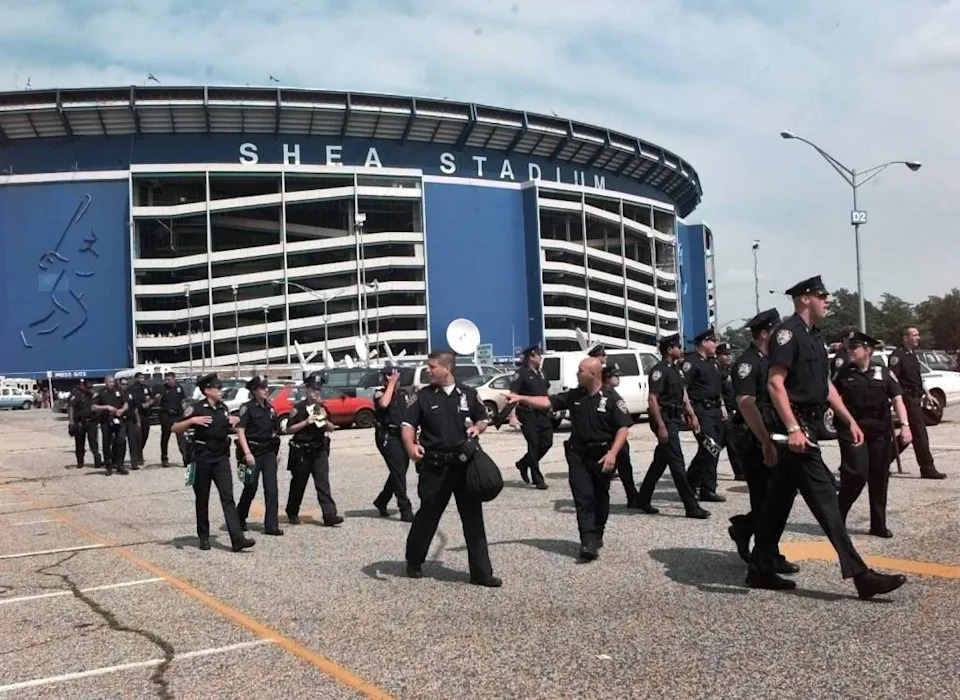 New York City Police officers assemble outside Shea Stadium for security for John Rocker. New York Post/Francis Specker
