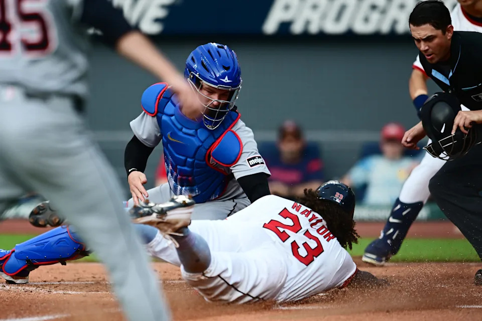 Cleveland Guardians catcher Bo Naylor (23) is tagged out at home by Detroit Tigers catcher Dillon Dingler (13) during the second inning at Progressive Field in Cleveland on Friday, July 4, 2025.