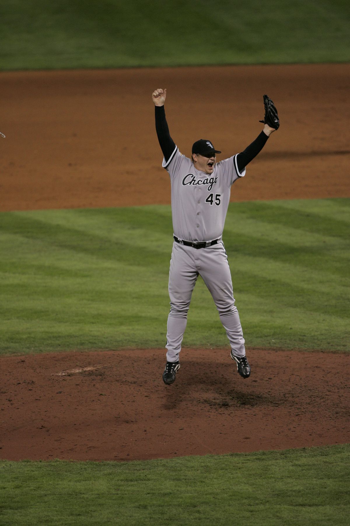 Bobby Jenks celebrates by jumping in the air after winning the World Series for the Chicago White Sox on October 26, 2005.
