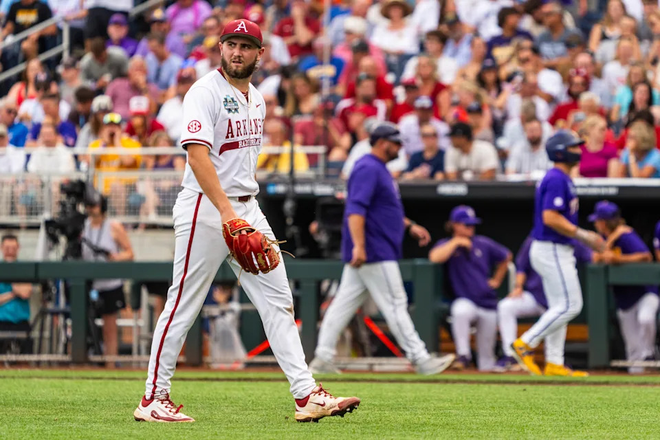 Jun 14, 2025; Omaha, Neb, USA; Arkansas Razorbacks starting pitcher Zach Root (33) walks off the mound during the second inning against the LSU Tigers at Charles Schwab Field. Mandatory Credit: Dylan Widger-Imagn Images