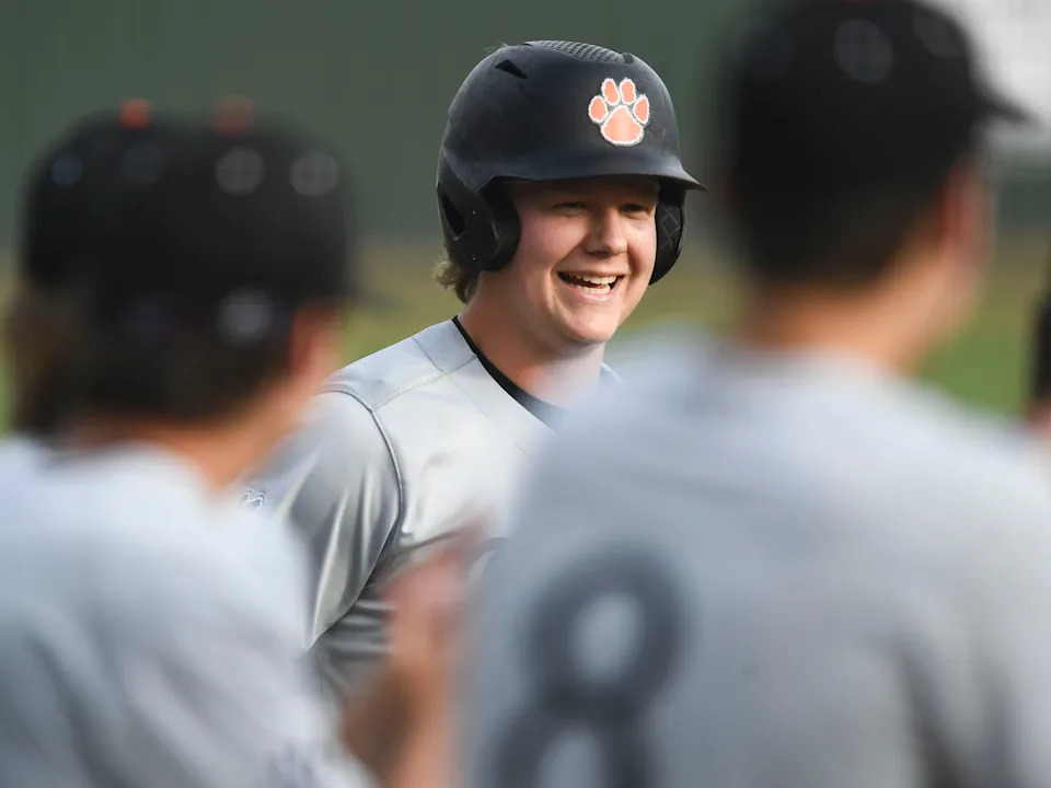 Powell High School's Logan Poteet is greeted by teammates after hitting a two-run homer against Farragut High School in the Region 2-4A high school baseball championship in Knoxville on May 18, 2022. The Chicago Cubs selected Poteet in the 17th round of the 2025 Major League Baseball Draft.