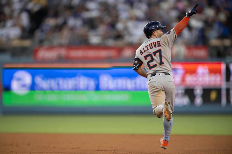 The Astros' Jose Altuve gestures after hitting a three-run home run during the sixth inning against the Dodgers.