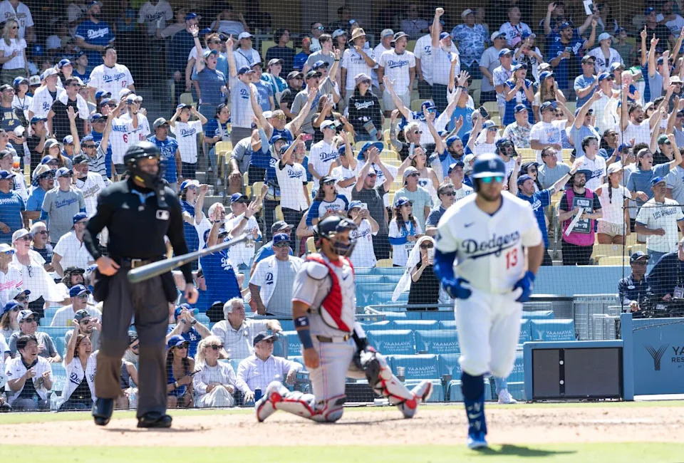 Fans cheer after Dodgers third baseman Max Muncy hit a three-run homer against the Washington Nationals.