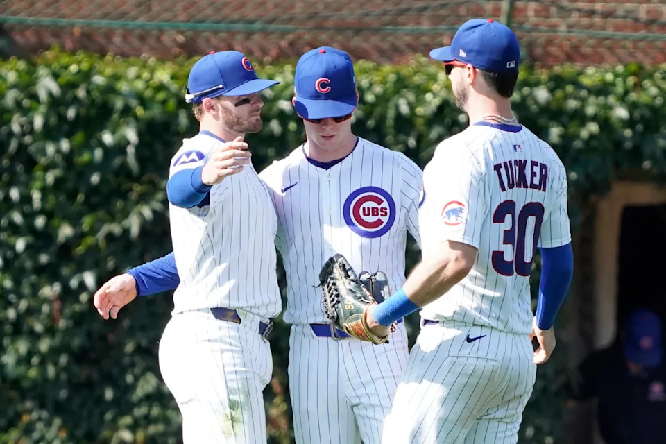 L-R Chicago Cubs outfielder Ian Happ (8), outfielder Pete Crow-Armstrong (4,) and outfielder Kyle Tucker (30) celebrate their win against the Seattle Mariners at Wrigley Field.David Banks-Imagn Images